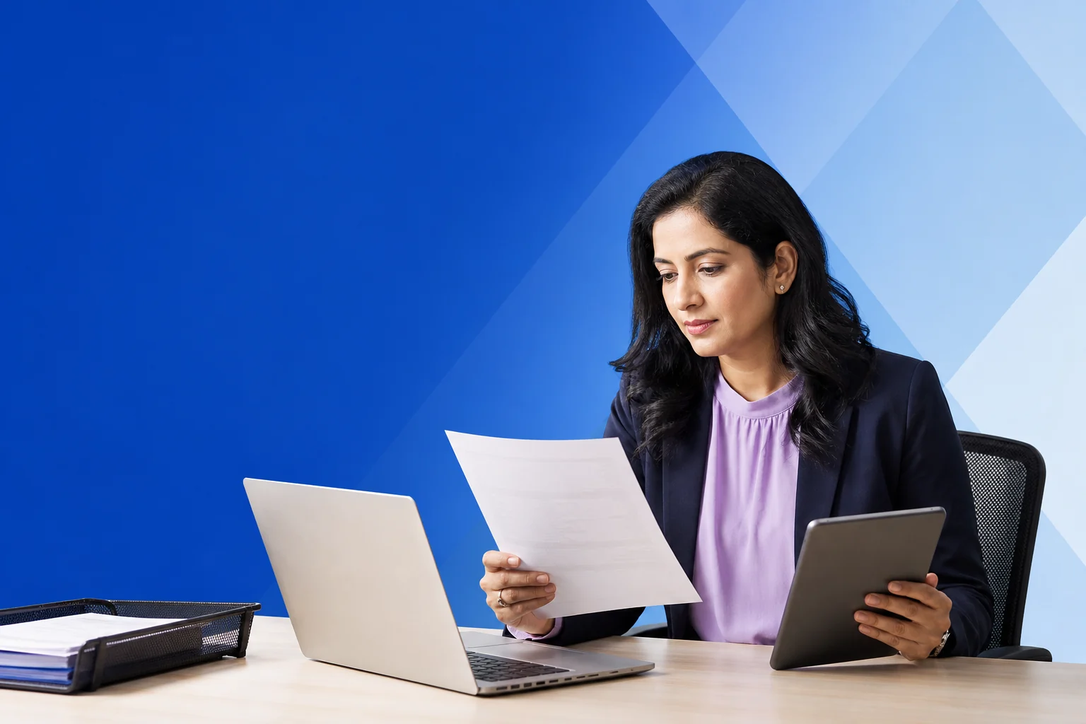 Indian finance reviewer comparing a project bill across documents and devices